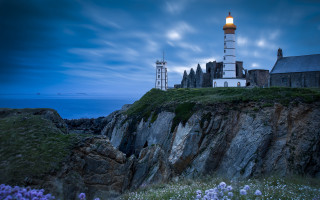 Lighthouse cliff night cloudy matte - a lighthouse free wallpaper