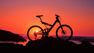 Bike parked rock sunset ocean - the rock free wallpaper