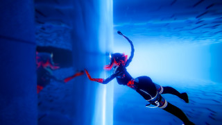 Woman diving blue water tunnel - space free wallpaper