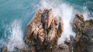 Rock formation wave boat lake - a rock formation free wallpaper