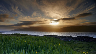 Sunset grass field mountains lake - david paton free wallpaper