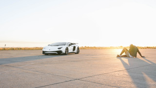 Man white car parking lot - the ground next free wallpaper