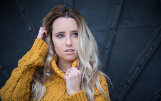 Blonde woman yellow sweater hands - a yellow sweater free wallpaper
