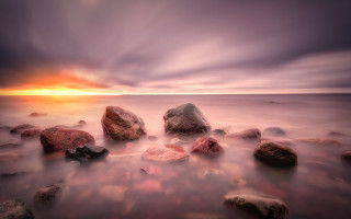 Long exposure rocks water sunset - a cloudy sky in the background free wallpaper for desktop