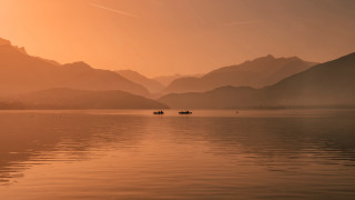 Boats lake sunset mountains clouds - free sunset wallpaper