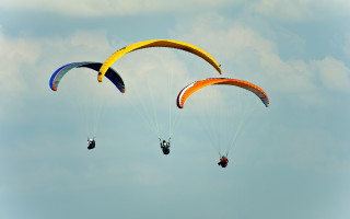 Parasailing two people sky clouds - one person free wallpaper