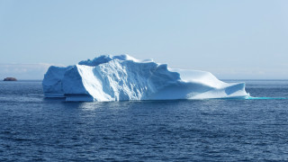 Iceberg ocean sky clouds beach - a large iceberg free wallpaper