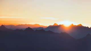Sunset mountain range plane clouds 3 - a plane free wallpaper for desktop