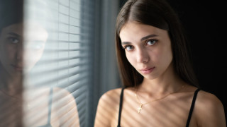Woman reflection necklace fence portrait - a necklace free wallpaper