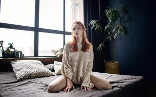 Woman sitting bed window plant - a bed in a room free wallpaper