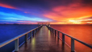 Pier sunset mystical colors cityscape - a long pier free wallpaper