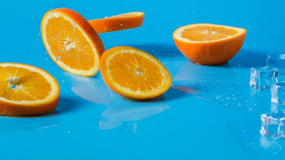 Oranges halved ice blue surface - a blue surface free wallpaper