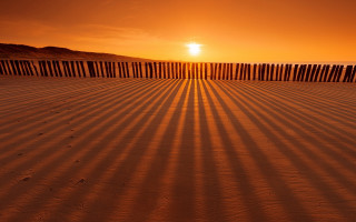 Beach fence sunset person sand - eric deschamps free wallpaper