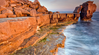 Rocky cliff water formation autumn - a rock formation in the background free wallpaper