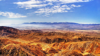 Mountain range clouds sunset fire - a view of a mountain range free wallpaper for desktop