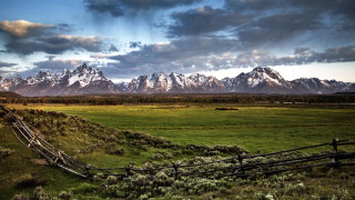 Fence mountains clouds sunset landscape - in a field free wallpaper