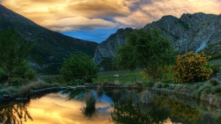 Pond mountains trees cloudy sky 4 - a pond free wallpaper