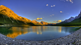 Lake mountains rocks sky sun 2 - under a blue sky free wallpaper