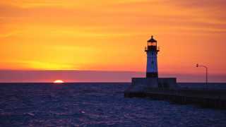 Lighthouse pier sunset water city - a lighthouse free wallpaper