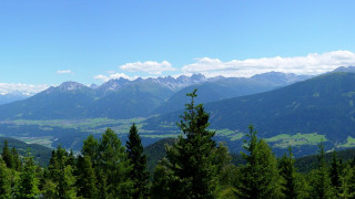 Mountain range valley trees beach - a view of a mountain range free wallpaper for desktop