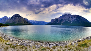 Lake mountains cloudy sky rocks - mountain under a cloudy sky free wallpaper