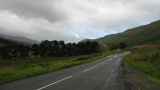Road curved hill trees lake - both side free wallpaper
