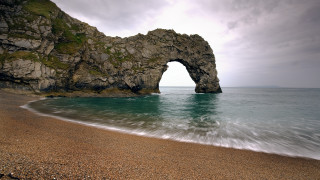 Rock formation beach ocean arch - a rock formation free wallpaper