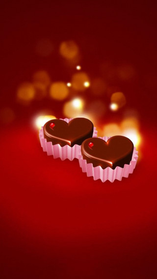 Heart shaped chocolates red background - romanticism free wallpaper for mobile