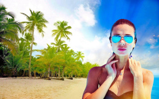 Beach woman sunglasses palm trees - cloud and sun beams free wallpaper