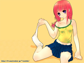 Red haired girl sitting crossed - a yellow background free wallpaper