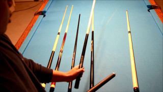 Man holding pool cues pool - a pool table free wallpaper