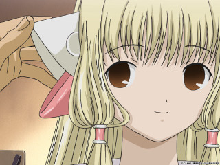 Blonde girl ponytailed closeup smile - a hand free wallpaper