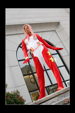 Woman red white outfit ledge - large free wallpaper