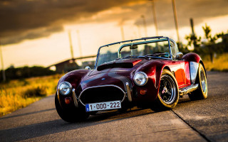 Red sports car sunset cloudy 3 - a red sports car free wallpaper
