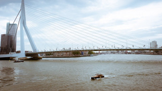 Boat river bridge tall building - cable wire free wallpaper