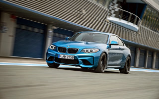 Blue car driving street building 2 - a blue car free wallpaper