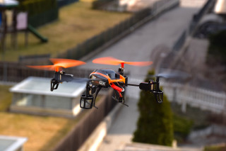 Orange black drone flying city - remote free wallpaper for desktop