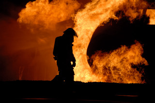 Firefighter large fire flames background - art photography free wallpaper
