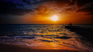 Sunset ocean bench waves person - the shore and a person free wallpaper