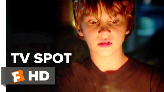 Boy holding candle dark room - spot free wallpaper