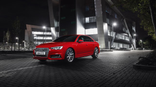 Red car night city scene - a black car free wallpaper