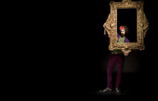 Man holding large mirror dark - rembrandt style free wallpaper