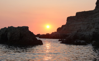 Sunset water rocks boat mountain - exekia free wallpaper for desktop