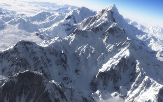 Mountain range airplane window blue 4 - an airplane window free wallpaper