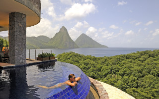 Man swimming mountains cityscape beach - eric deschamps free wallpaper