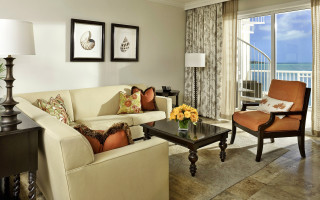 Livingroom oceanview balcony couch chair - color free wallpaper