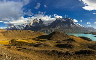 Mountain lake panorama clouds sky - a lake in the foreground and a mountain range in the background free wallpaper