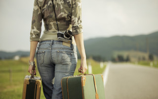 Woman suitcases camera road camouflage - liminal space free wallpaper for desktop