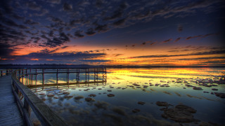 Pier sunset clouds water rocks - a pier free wallpaper