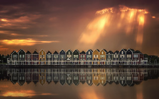 Houses lake cloudy sunbeam mystical - a row of houses free wallpaper